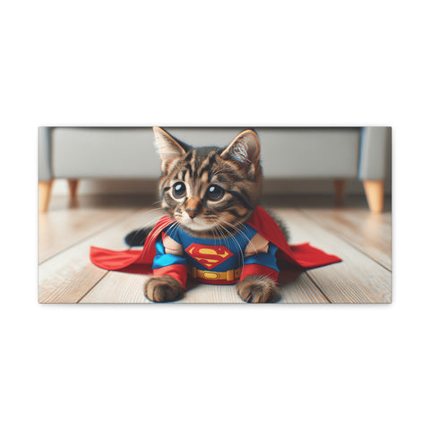 A canvas art piece featuring a cute cat dressed in a Superman costume with a cape, lying on a wooden floor.