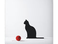 A minimalist canvas art featuring the silhouette of a cat sitting and gazing at a red ball on a white background.