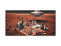 This canvas art depicts three people having a picnic on the surface of Mars with a flying saucer overhead and a vast, rocky landscape in the background.