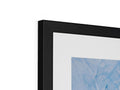 A single shot of a picture frame on the wall with a print displayed on the side