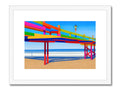 A colorful photo of beach, life guard and a park and a small wooden structure.
