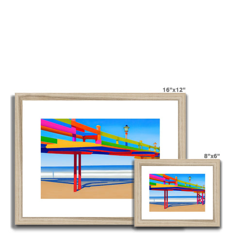 Three pictures sit in a wooden frame sitting on top of a table with a metal frame