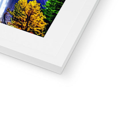 a beautiful white photo frame with a tree in a forest and a mountain in the background