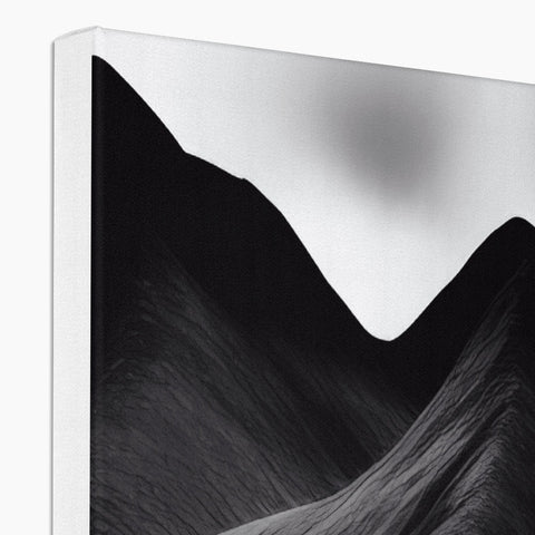 A digital photo showing mountains on a piece that is sitting on a white desk.