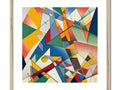 A geometric art print hanging on a wall with other paintings of paintings and kite flying