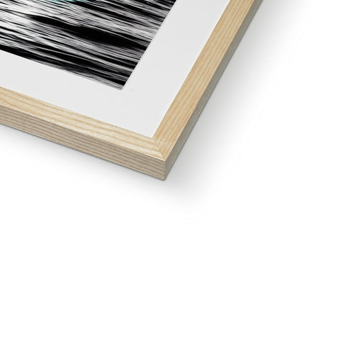An abstract photo of animal hair is placed in a wooden frame.
