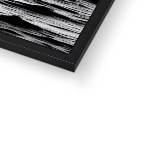 The top section of a picture frame is in plain white and black.