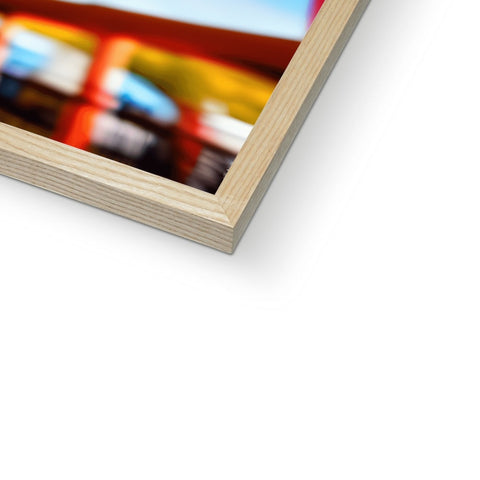 Close up of a picture frame with a frame and the wood panel in front of it