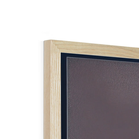 A picture frame on top of a large brown frame.