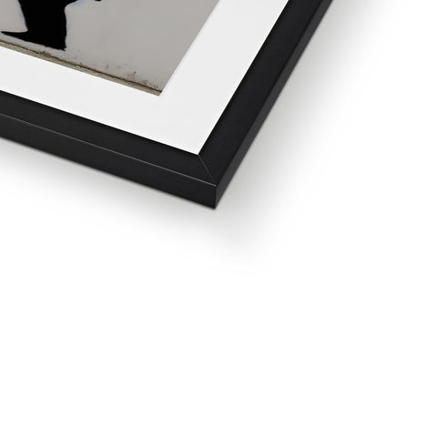 A white picture frame with a black and blue photograph on it.