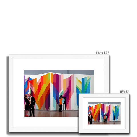 A set of colorful prints hanging in large square wall.