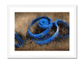 An  eart print in blue with white and black border.