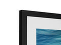 A framed photo of an imac that has a black picture of the picture.