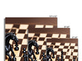 Four horses are fighting on a chess board that is covered in black cards.