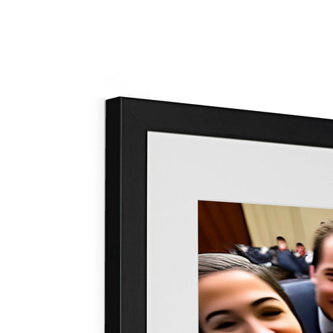 A digital photo frame with a picture of someone being talked at at a conference.