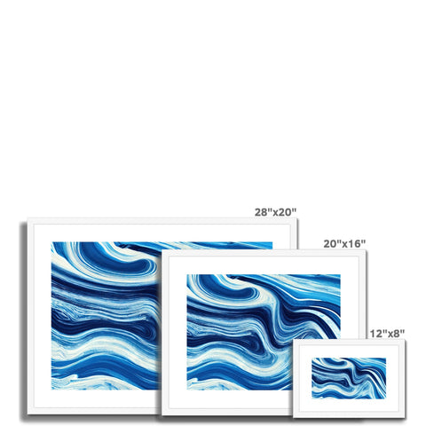 A couple of colorful decorative wall hanging picture frames and a large print of the ocean waves