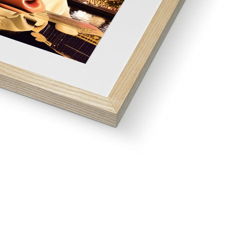 A picture frame with a piece of wood with a softcover photo of a photo.