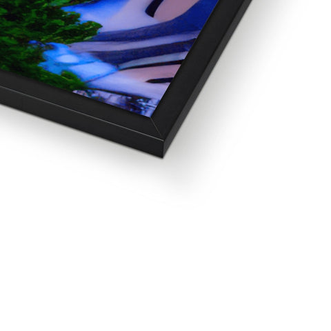 Picture frame with a blurry image of a picture hanging in front of a wall.