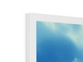 A picture frame with an  imac screen, ceiling, and a blue sky.
