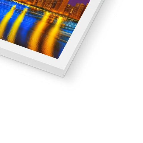 A softcover photo framed in white paper with a blurred background.