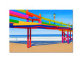 A boardwalk at a beach in front of a life guard tower with a colorful picture