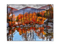 A colorful print of mountains and river bed with a forest backdrop
