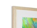 Art print sitting on top of a picture frame of abstract art.