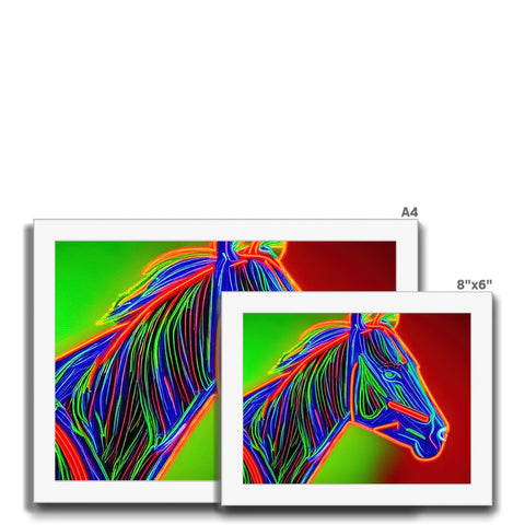 A picture of three horses that are racing past a small black and white computer screen.