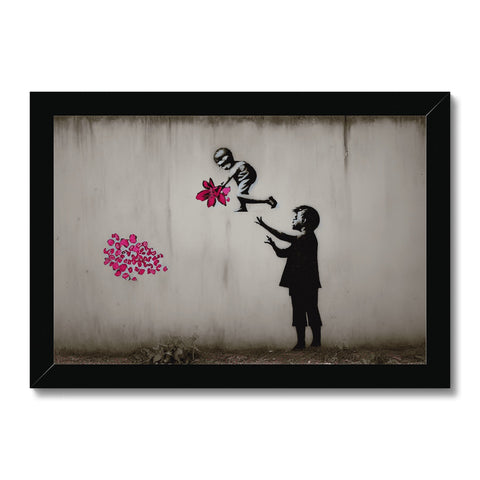 A little girl holding a flower near a large bunch of spray printed spray