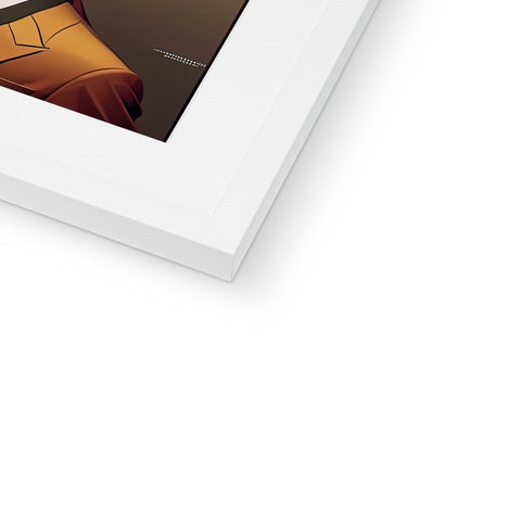 A tablet is in a white frame on the top corner of a desk with a framed