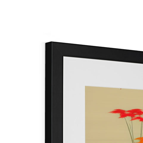 An art prints on top of a flat screen television display panel surrounded by flowers.