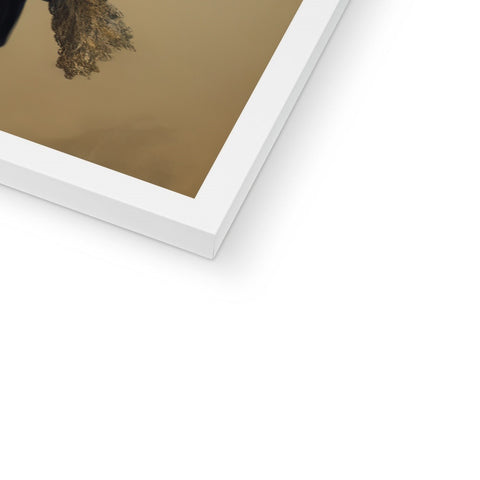A white photo on top of a picture frame held in a frame.