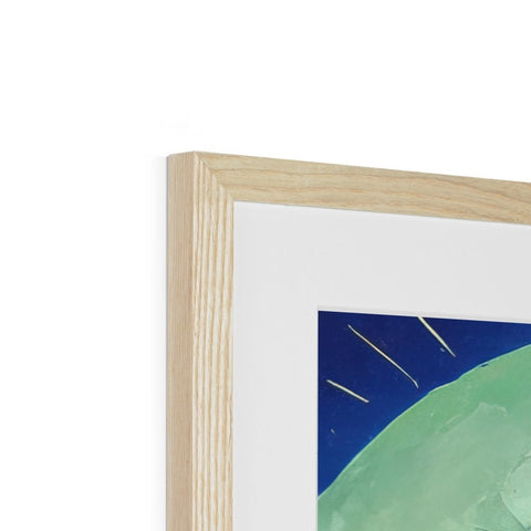A wooden frame contains some art and an image of a woman on the moon.