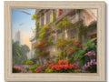 A picture printed in charcoal on a very colorful frame of a tropical setting.