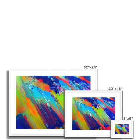 A picture frame filled with colorful artwork on a table with three iPads and a monitor