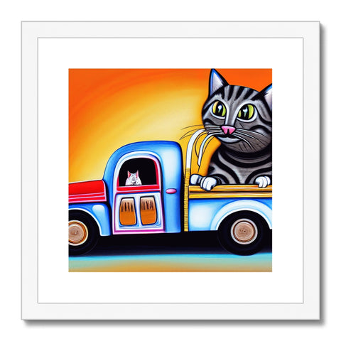 A cat sitting in a motor home with a colorful background.