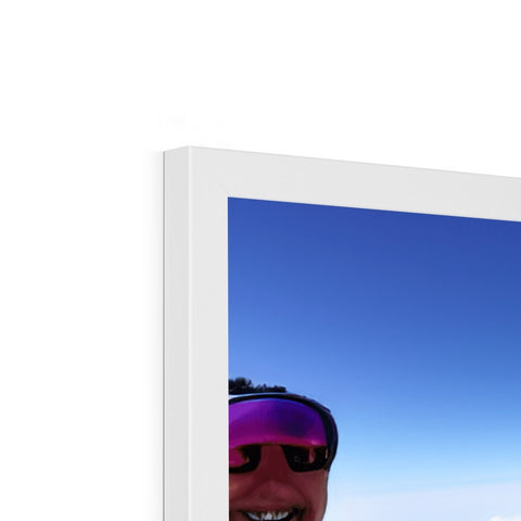 A white picture frame of sunglasses with a picture of someone smiling.