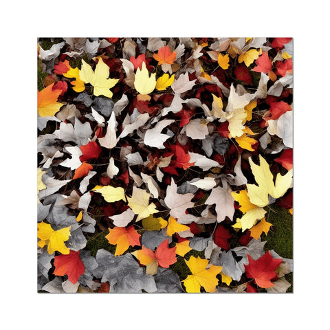 A blanket that is covered in many leaves and is covered with other foliage of different colors