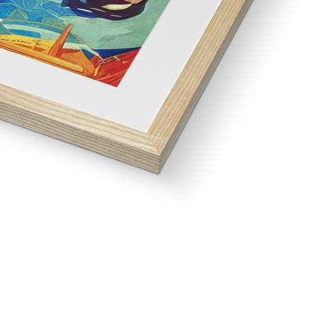 An art print sitting on top of a wooden frame on a table.