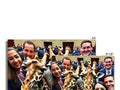 A group of giraffes standing next to each other holding big antlers on a