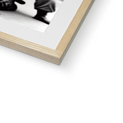 A black and white photo is attached to a book with a booklet in the background.