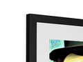 A black photo on a photo frame with a colorful image of an open painting in the