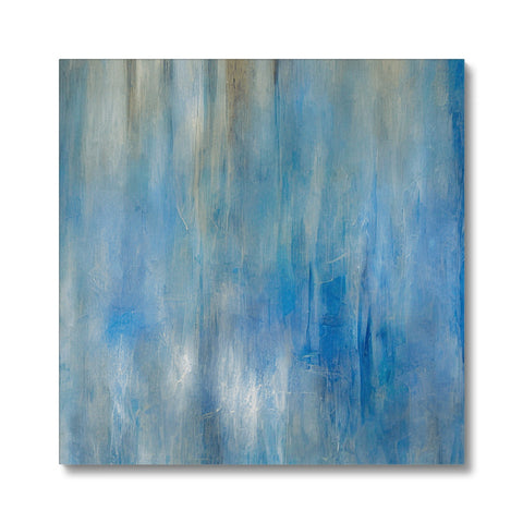 A blue canvas is hanging on a glass wall with a beach and colorful beach waves.
