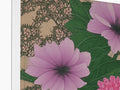 A white floral patterned softcover paper notebook with flowers.