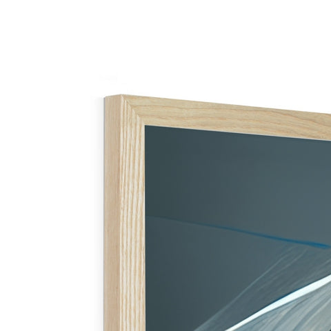 A close up of a wooden flat screen tv screen framed in a picture frame.