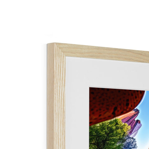 A glass picture frame is placed on top of a wooden wall.