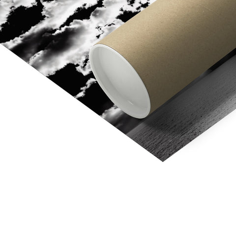 A toilet paper roll in a yellow, rollup paper roll with black and white printed