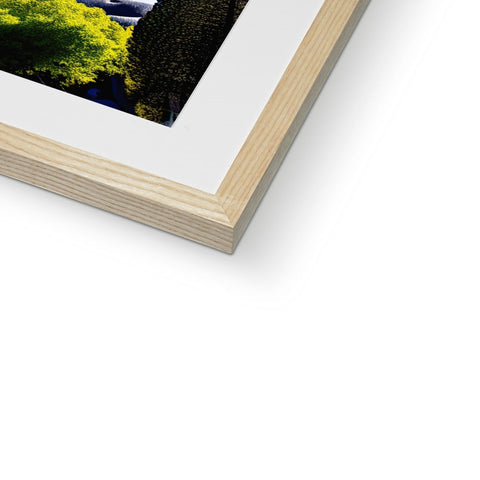 A softcover photo of a picture frame of a wood frame that is framed in wood