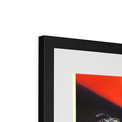 a picture frame with a red poster of a sunset on it