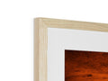 A view of a picture of a fireplace sitting on a wooden frame as it is in